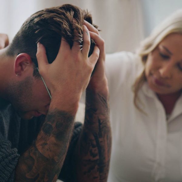 Sad, stress and depression people in therapy for mental health support, empathy and professional help of woman giving advice or listening to problem. Depressed, anxiety and cry man with psychologist Sad, stress and depression people in therapy for mental health support, empathy and professional help of woman giving advice or listening to problem. Depressed, anxiety and cry man with psychologist.